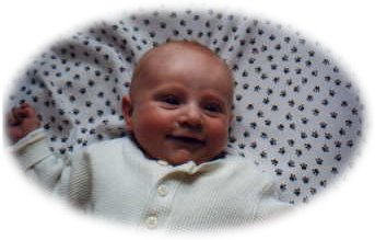 Smiling in the playpen.