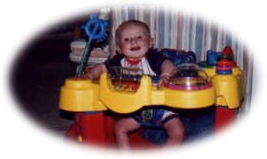 Nathan in the exersaucer.